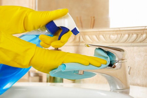 Professional carpet cleaner using safe methods and protective gear
